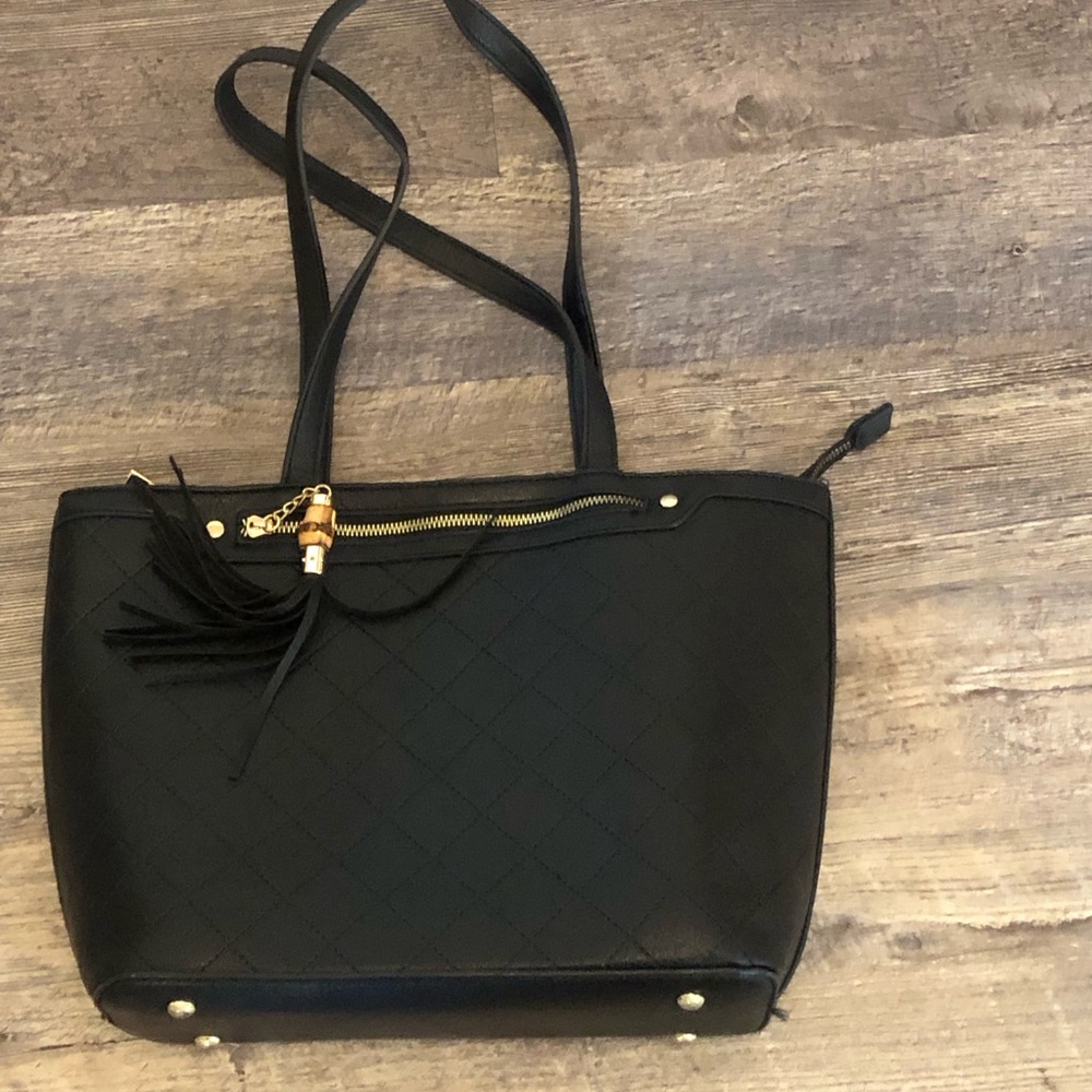 No brand black purse has some ink inside